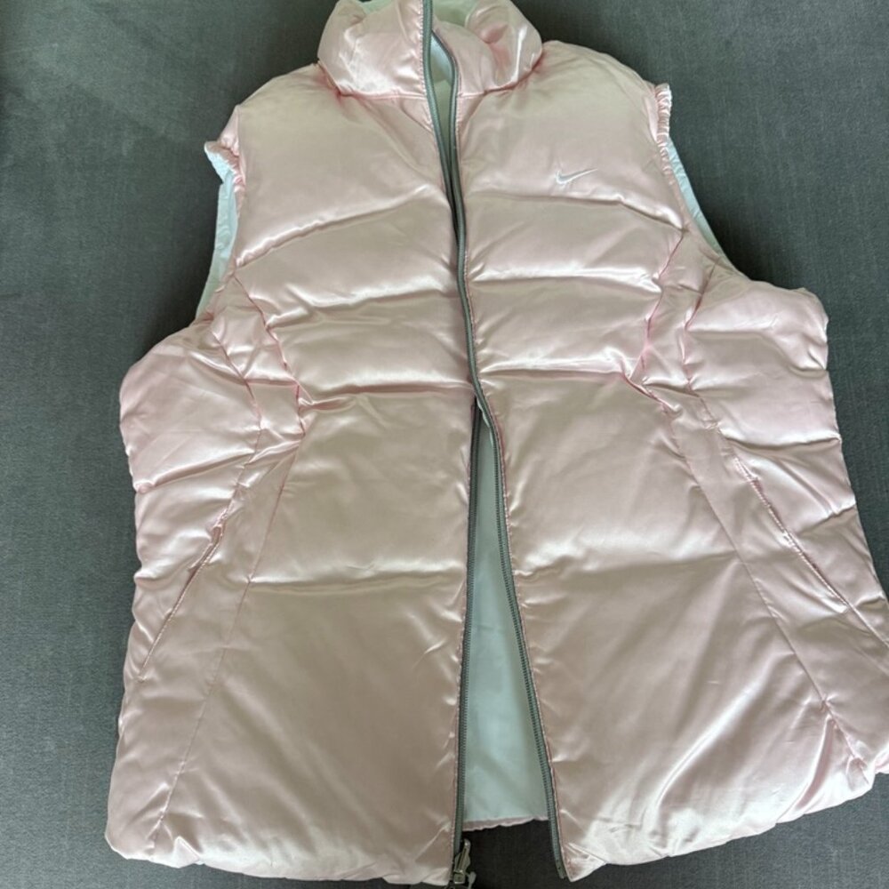 Brand New Nike Womens reversible puffer vest. 2 in 1 vest in unworn condition.
